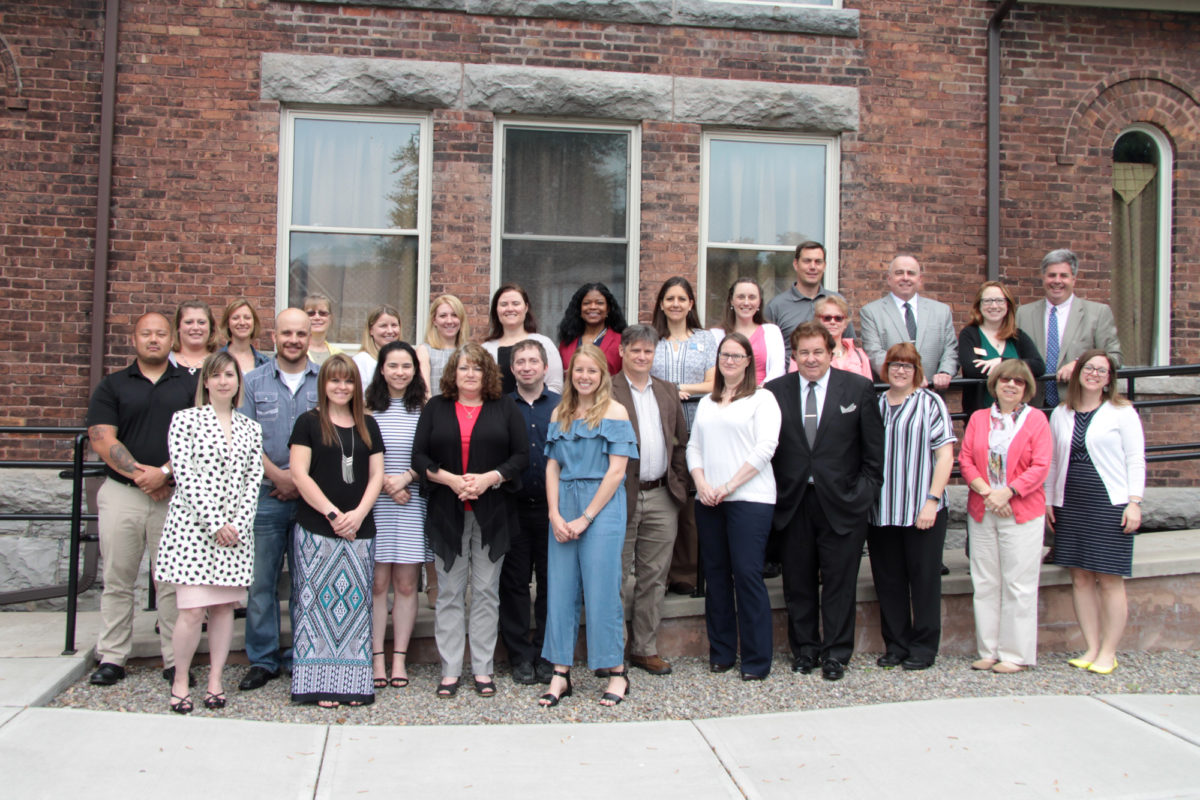 Leadership Cayuga Class of 2019 and alumni pose for a photo outside Euterpe Hall in Auburn, NY, on graduation day, May 30, 2019.